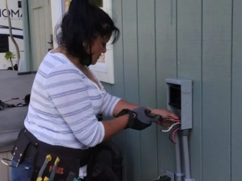 Licensed electrician wiring an exterior subpanel in Dolton